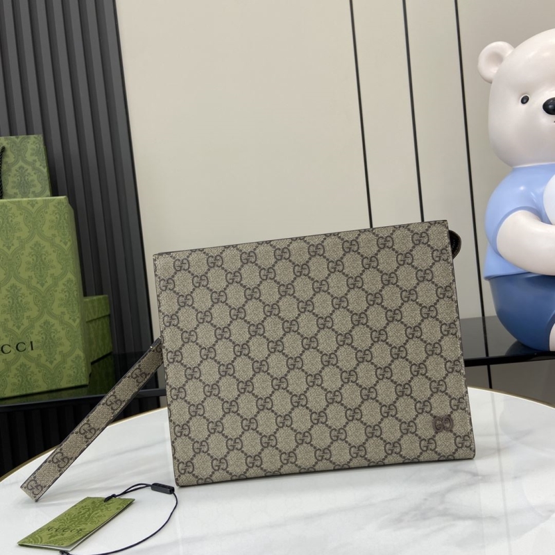 G*u*i clutch bags